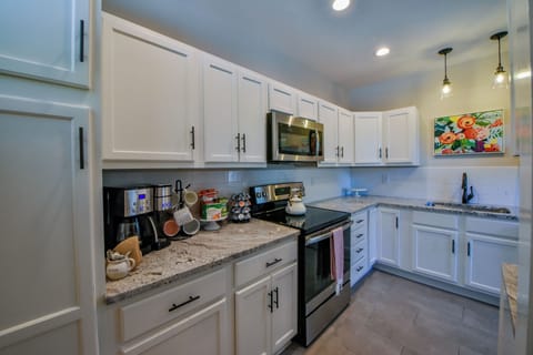 Kitchen - The kitchen has two different coffee makers to keep everyone awake during your stay.