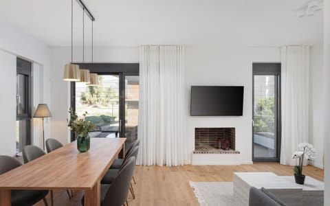 Apartment, City View | Living area | 50-inch Smart TV with satellite channels, fireplace, Netflix