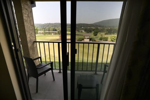 Private balcony with stunning views of the surrounding landscape, ideal for enjoying the outdoors.