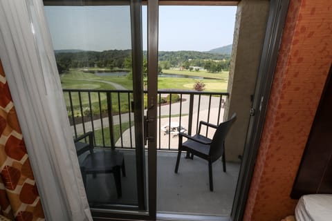 Private balcony with seating and beautiful views of the surrounding golf course.
