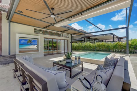Deluxe Villa, Patio, Pool View | Living area | 55-inch plasma TV with cable channels