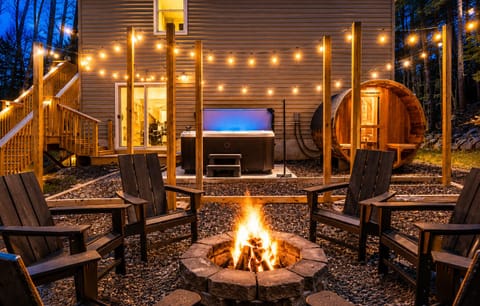 Gather around the fire, soak in the hot tub, and recharge in the barrel sauna—all just steps from the house.