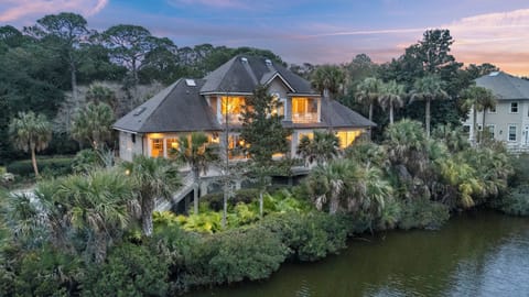 Welcome to 18 Flyway! Nestled between coastal trees and lagoon views.