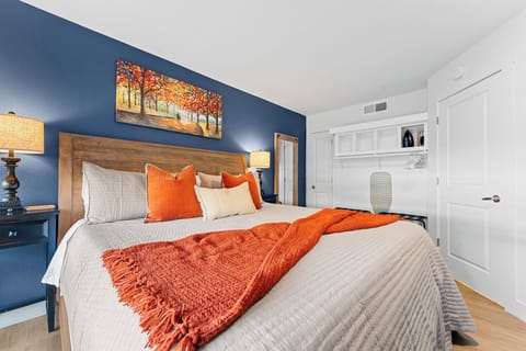 Enjoy a peaceful sleep:  King bed topped with a Tempur-Pedic mattress topper. 