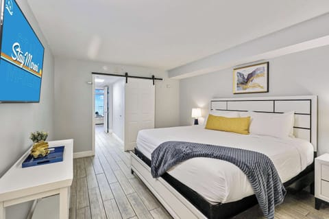 Drift into comfort in this stylish bedroom featuring a plush king bed, smart TV, and modern coastal decor. The perfect place to relax after a day of sun and sand during your unforgettable Myrtle Beach escape!