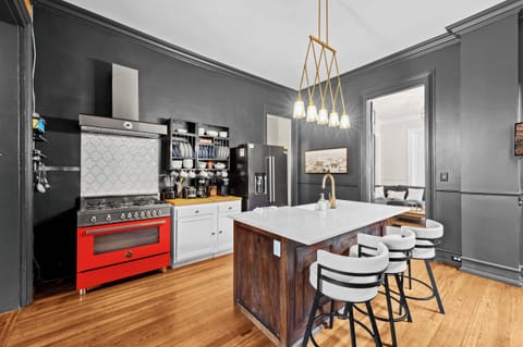 Kitchen: A sleek and fully equipped kitchen awaits, perfect for preparing meals or enjoying a quick bite before heading out.