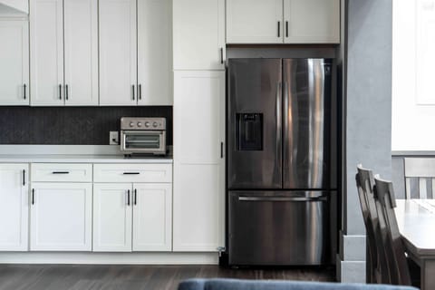 The chic, open kitchen offers ample space & every home comfort