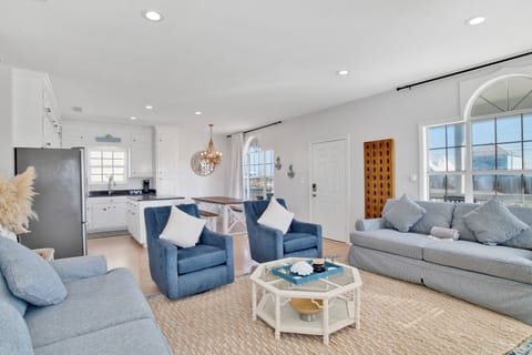 The living room has a sleeper sofa and TV