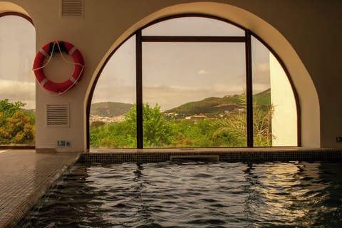 Indoor pool, seasonal outdoor pool, pool umbrellas, sun loungers