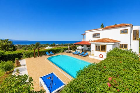 A stunning Mediterranean villa featuring a private pool, outdoor billiard table, and spacious sun terrace with panoramic sea views.