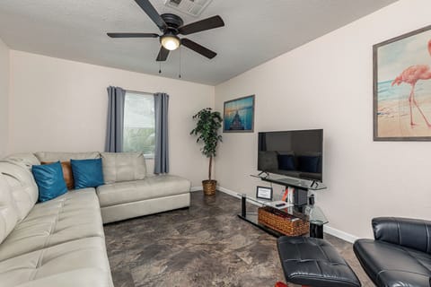 This private living room comes with strong wifi, a Roku TV, and a comfy couch!