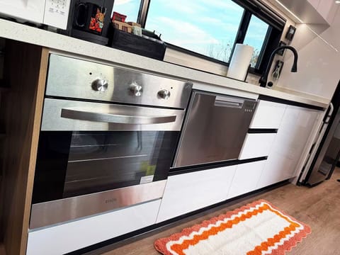 Full kitchen with stove, oven, dishwasher, and all necessary cooking items