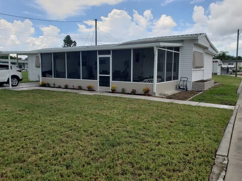 2 Bedroom - 1.5 Bath with 2 seating areas, full kitchen, utility room and lanai.