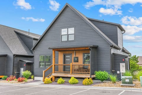 - Step into your getaway through a modern door with sleek glass accents
- Keyless smart lock makes check-in easy and secure for guests
- Cozy porch with scenic views to greet you before you even walk in