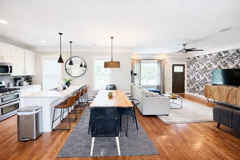 Spacious open floor plan with a bright kitchen, dining area, and comfy living room—plus a sofa that converts into a queen sleeper for extra guests. Perfect for groups to gather and relax!