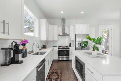 Kitchen: Main floor,drip coffee maker, keurig, crockpot, toaster, cooking utensils, tableware