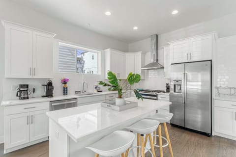 Kitchen: Main floor,drip coffee maker, keurig, crockpot, toaster, cooking utensils, tableware