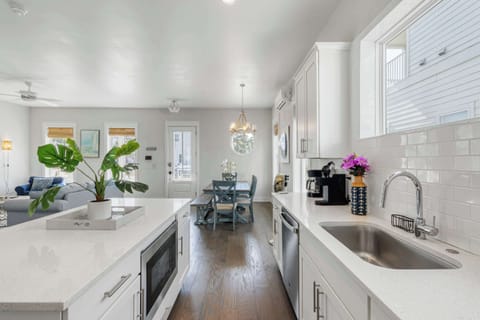 Kitchen: Main floor,drip coffee maker, keurig, crockpot, toaster, cooking utensils, tableware