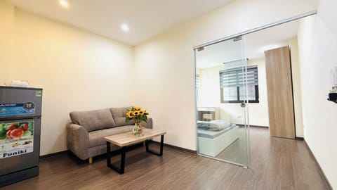 Basic Apartment | Living area | 20-inch TV with satellite channels
