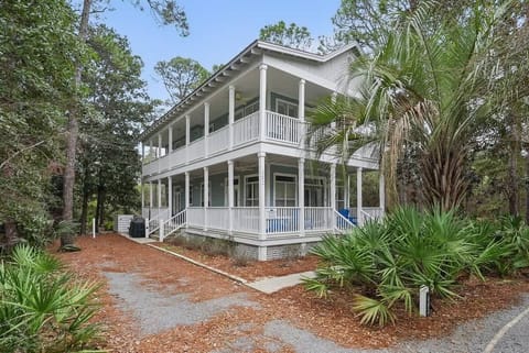 - Wrapped in peaceful greenery, this two story retreat invites you to slow down and breathe in the calm - Sip your morning coffee or unwind with a book on the wraparound porch - Tucked away yet close to beaches, trails, and town favorites