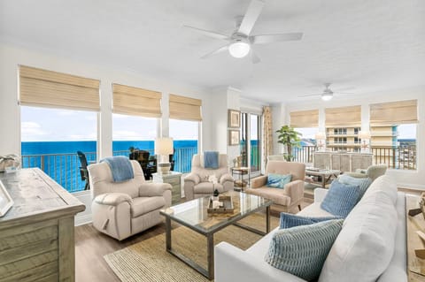 Relax in this bright living room with ocean views and comfortable seating.
