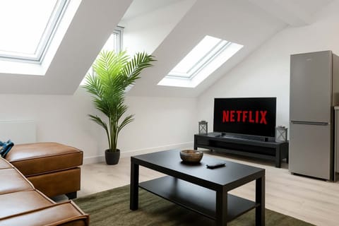 Living area with sofa bed and smart tv