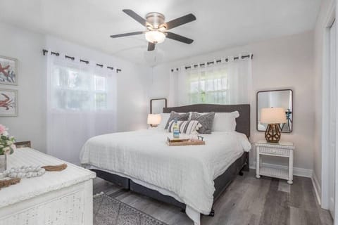 Second bedroom with king size bed, new wood laminate flooring, walk-in closet.