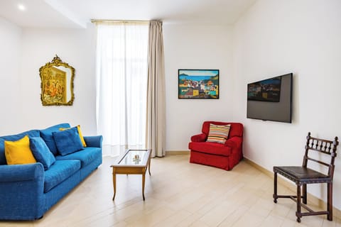 Family Apartment, Balcony | Living area | 35-inch TV with digital channels