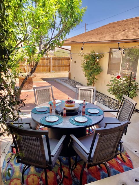 Outdoor dining table with fire pit.