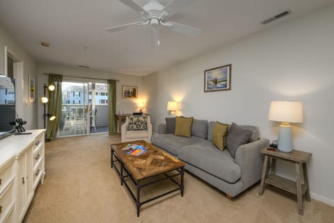 Bright coastal living room with comfortable seating and open concept layout