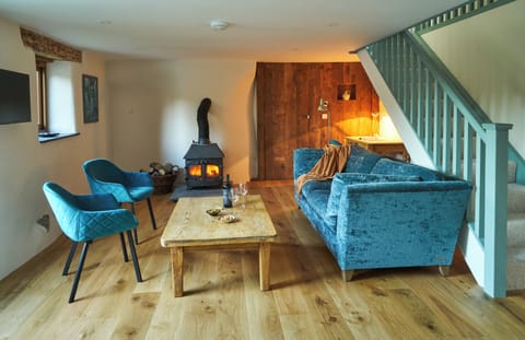 The lounge has a log burner for cool evenings. One basket of logs included.