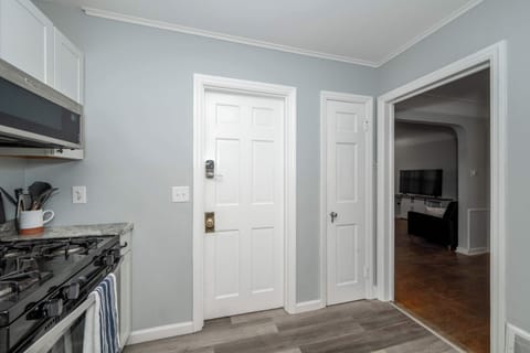 Apartment 1’s sleek kitchen offers ample space & all the comforts of home