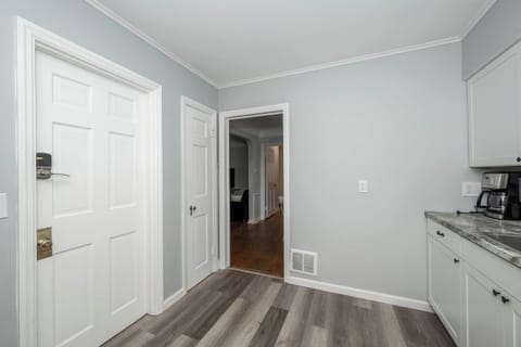 Apartment 1’s sleek kitchen offers ample space & all the comforts of home