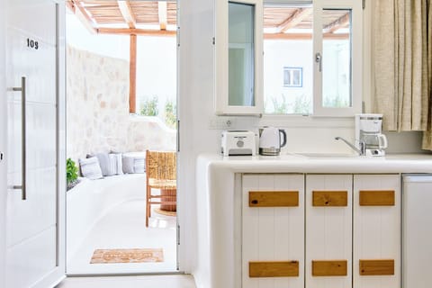 Superior Quadruple Room, Garden View | Private kitchen | Mini-fridge, highchair