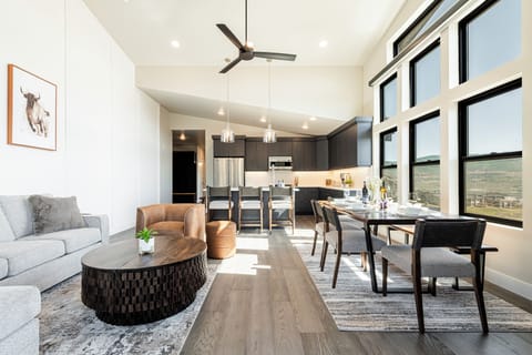 Great room with a vaulted ceiling and plenty of natural light and views