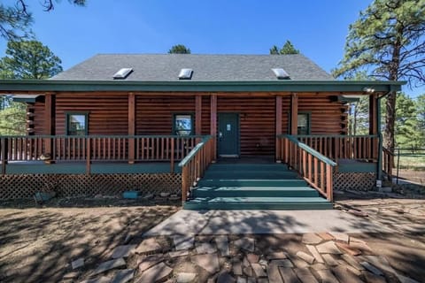 Front view of our Cabin, showcasing the wrap-around deck.