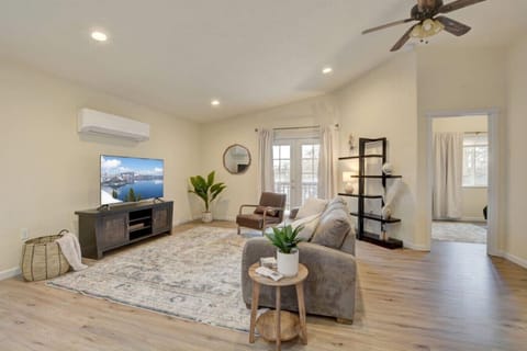 Spacious living area w/door access to balcony & 55` Roku TV!