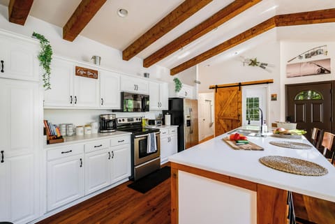 Open-plan kitchen featuring modern appliances.