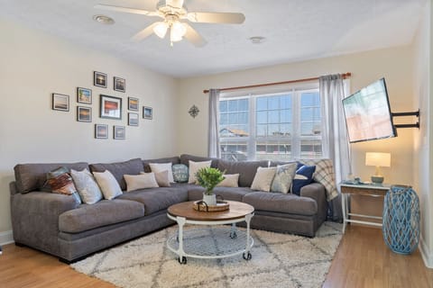 Large, comfortable, living room seating with smart TV