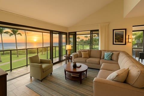 The open living room with slider doors on two sides of the room open to the ocean breezes