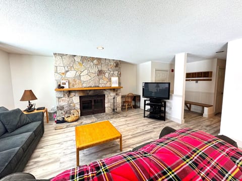 Living room with fireplace & 55` Smart TV