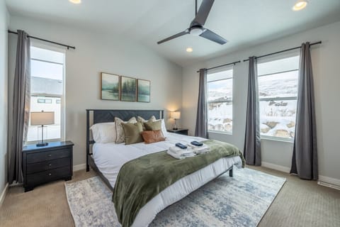 Wake up to mountain views in this cozy and bright bedroom retreat.