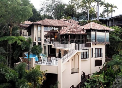 This award-winning three-level villa offers secure parking for two vehicles for a hassle-free arrival and departure, all set amidst lush tropical surroundings.