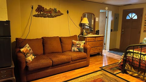 queen sleep sofa with queen bed downstairs with tv and gas fireplace.