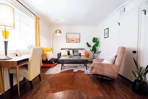 Living room with pull out sofa bed and desk.