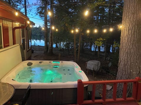 Eight person hot tub off of the bunk room, with views of the lake!