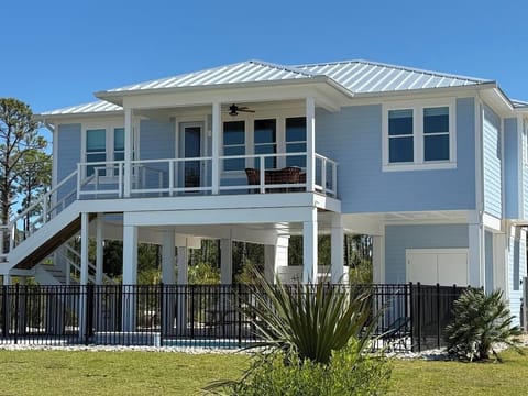 Porch looks out to the bay and over the pool
