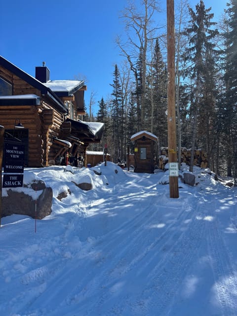 Condo entrance straight ahead on left. Guest parking shown in photo with signs.