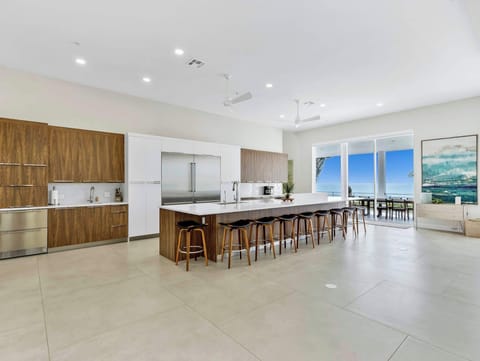 Kitchen with oversized island capable of seating 10 and Wolf/Sub Zero Appliances