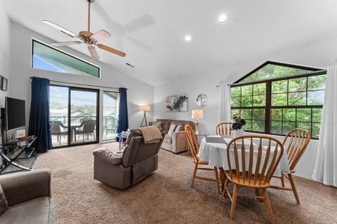 Cathedral ceilings, big windows, and an open layout make the main living space feel airy and easy to settle into.